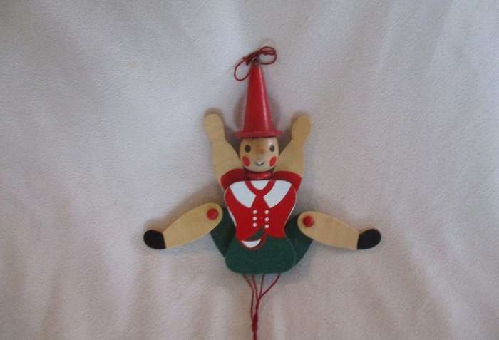 Two cute vintage wooden Pinocchios