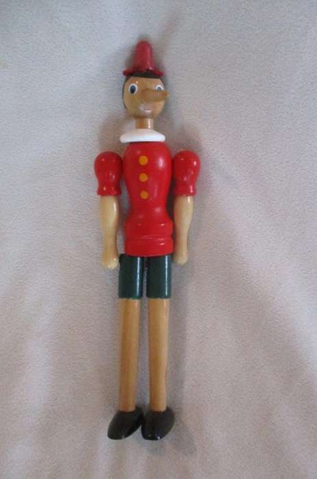 Two cute vintage wooden Pinocchios