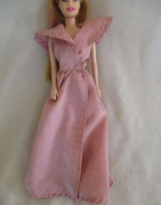 A pretty vintage doll with pink highlights and tinsel in her hair