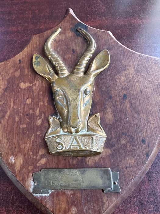 SAI brass & wood plaque