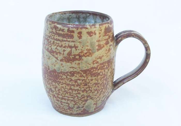 A vintage pottery mug with destinct makers stamps