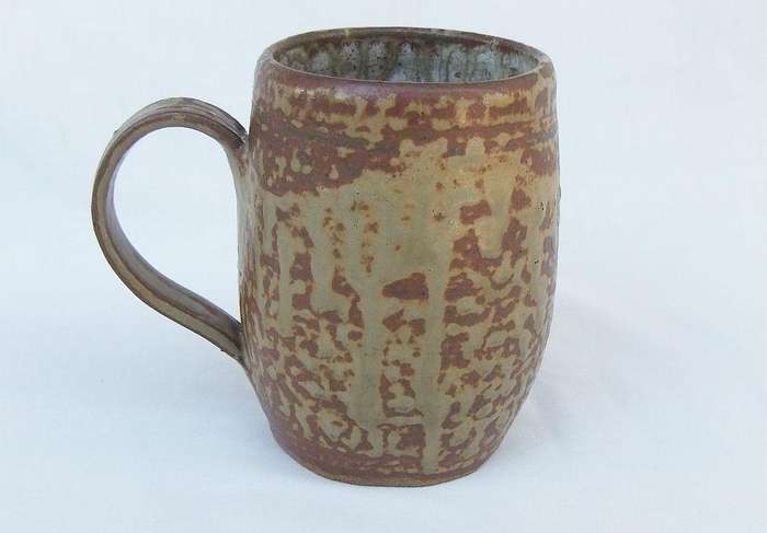 A vintage pottery mug with destinct makers stamps