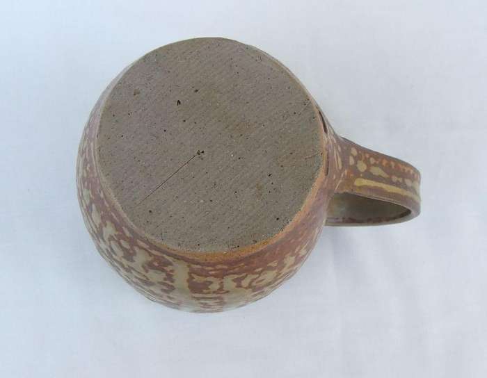 A vintage pottery mug with destinct makers stamps