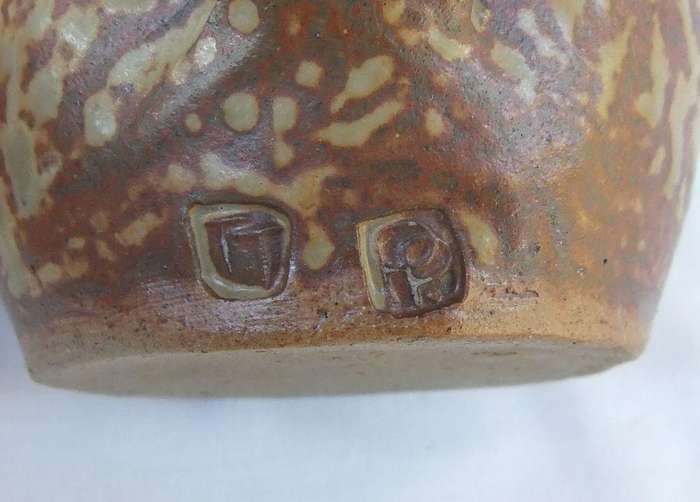 A vintage pottery mug with destinct makers stamps