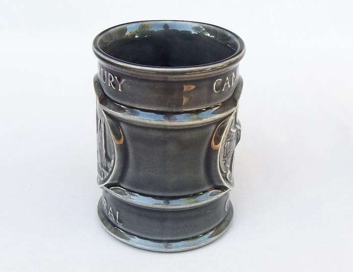 A vintage pottery mug by Holkham depicting the Canterbury cathedral