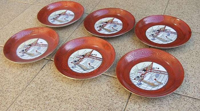 A set of six small Japanese hand painted plates / saucers with makers mark