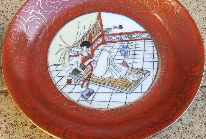 A set of six small Japanese hand painted plates / saucers with makers mark