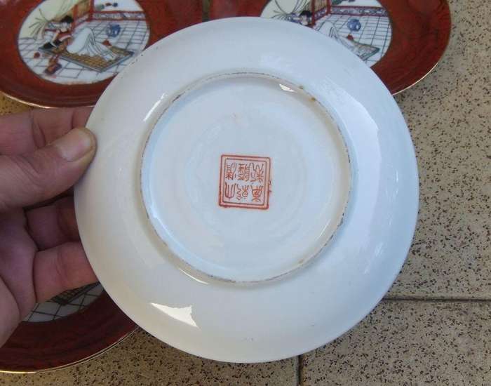 A set of six small Japanese hand painted plates / saucers with makers mark