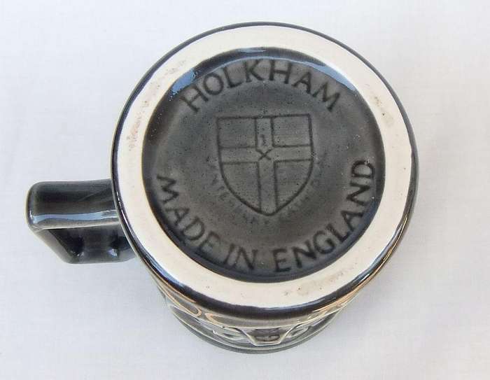 A vintage pottery mug by Holkham depicting the Canterbury cathedral