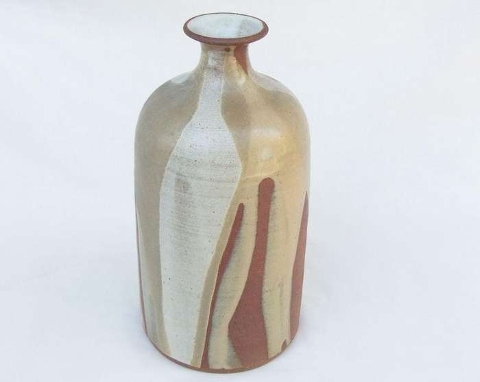 A heavy vintage pottery vase with makers stamp