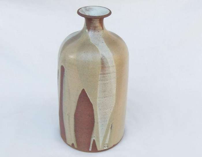 A heavy vintage pottery vase with makers stamp