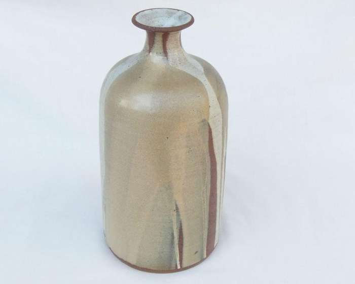 A heavy vintage pottery vase with makers stamp