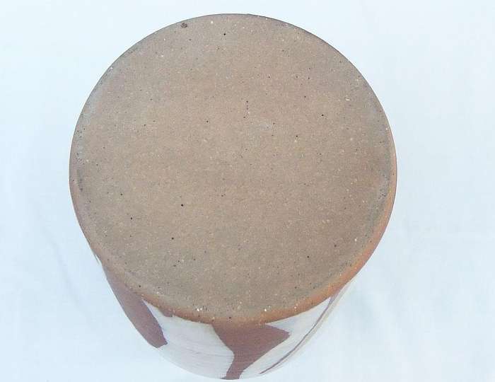 A heavy vintage pottery vase with makers stamp