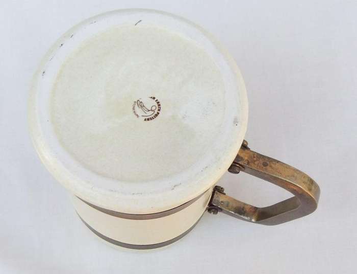 A vintage bar jug with wine / beer brewers theme and metal handle