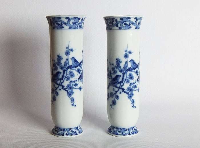 A pair of vintage blue and white porcelain Genuine Imperial Imari vases depicting birds