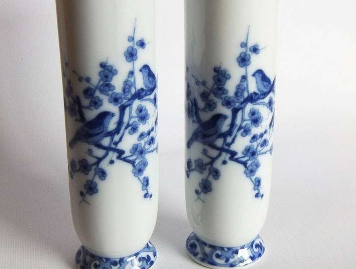A pair of vintage blue and white porcelain Genuine Imperial Imari vases depicting birds