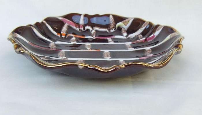 A vintage mid-century hand painted and numbered German pottery snack dish