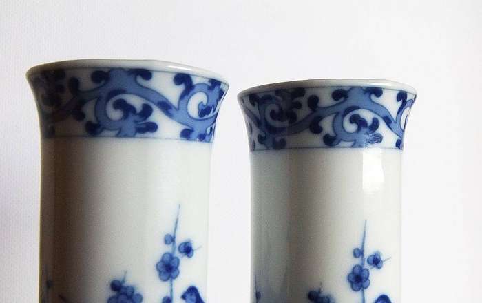 A pair of vintage blue and white porcelain Genuine Imperial Imari vases depicting birds