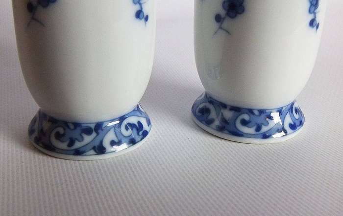 A pair of vintage blue and white porcelain Genuine Imperial Imari vases depicting birds