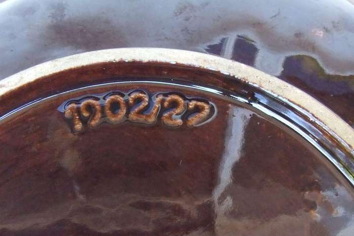 A vintage mid-century hand painted and numbered German pottery snack dish