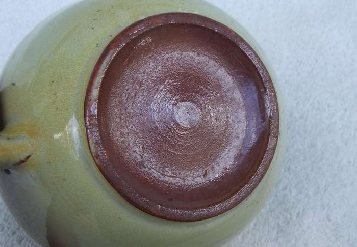 A vintage pottery ewer in the style of Globe or Linn ware pottery