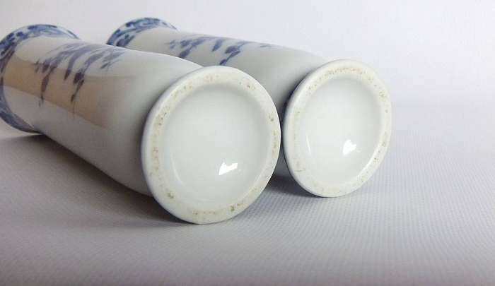 A pair of vintage blue and white porcelain Genuine Imperial Imari vases depicting birds