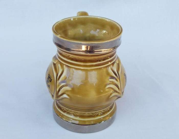 A vintage Wade porcelain jug with ALE motif