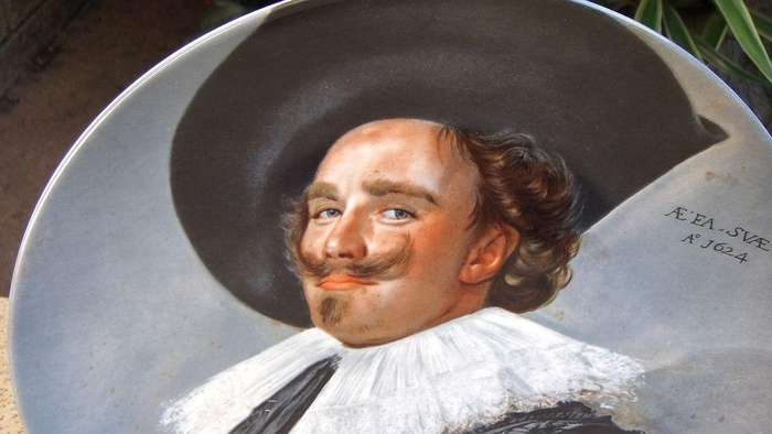 A vintage German made porcelain display plate by Kaiser depicting an image of Frans Hals