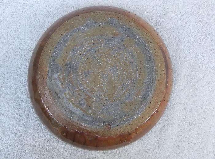 A large pottery serving bowl with makers stamp possibly by Hyme Rabinowitz