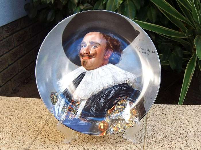 A vintage German made porcelain display plate by Kaiser depicting an image of Frans Hals