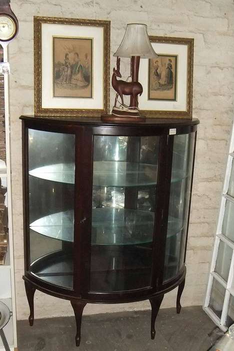 A rare vintage Rhodesian Teak half moon display cabinet made in Salisbury Rhodesia