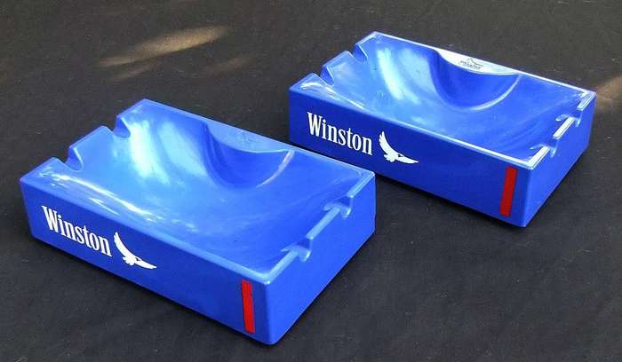 A pair of vintage Winston cigarette advertising ashtrays