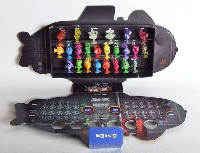 A collection of Stikeez figures with submarine holder which doubles as a board game