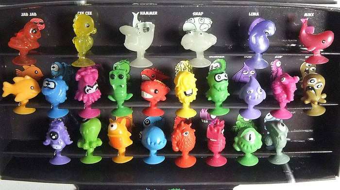 A collection of Stikeez figures with submarine holder which doubles as a board game