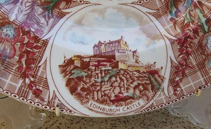 A vintage porcelain display plate by Weatherby depicting scenes of Scotland