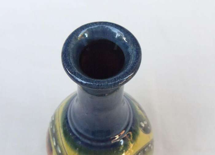 A signed vintage handmade pottery vase with octopus motif