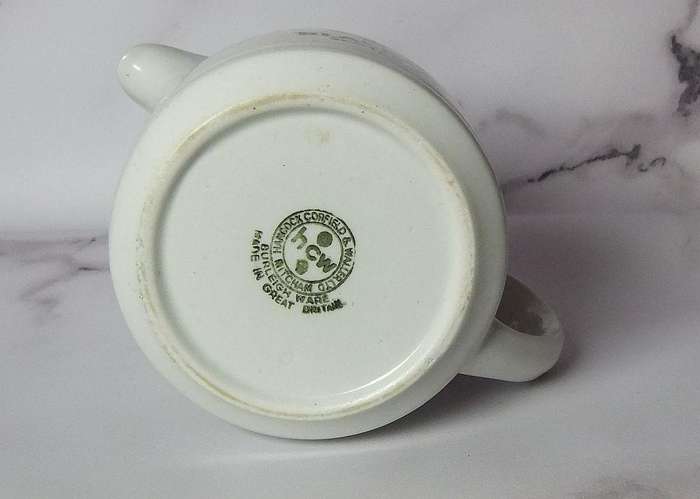 A vintage pub water jug advertising Black & White whisky
