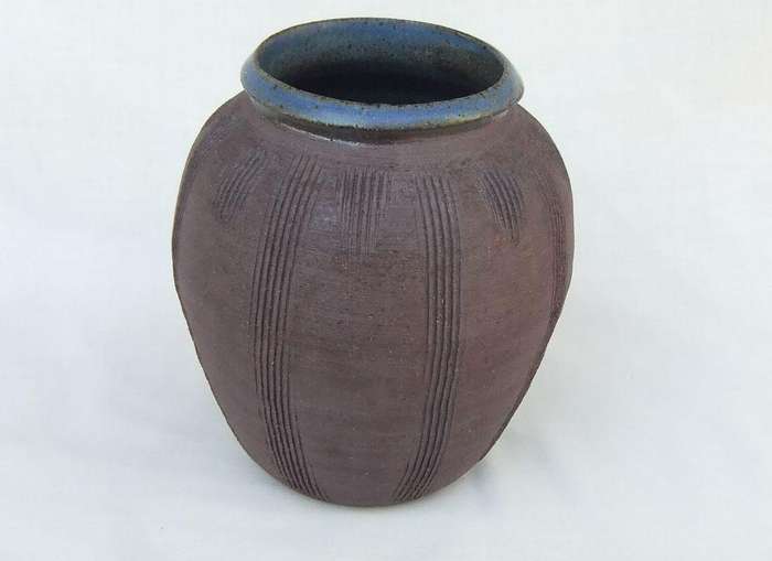 A vintage pottery vase with makers stamp on the base