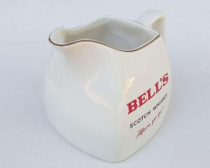 A vintage Bells whisky advertising bar water jug made by Wade England