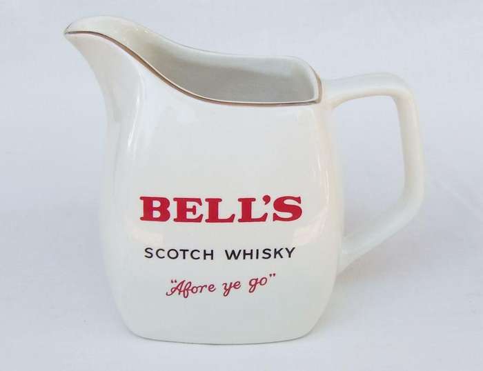 A vintage Bells whisky advertising bar water jug made by Wade England