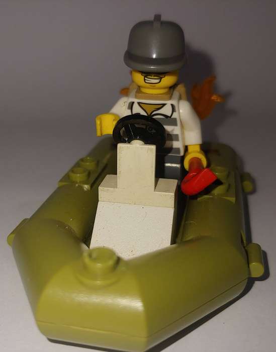 USED LEGO CRIMINAL IN BOAT WITH BAG OF MONEY NO INSTRUCTIONS OR BOOK