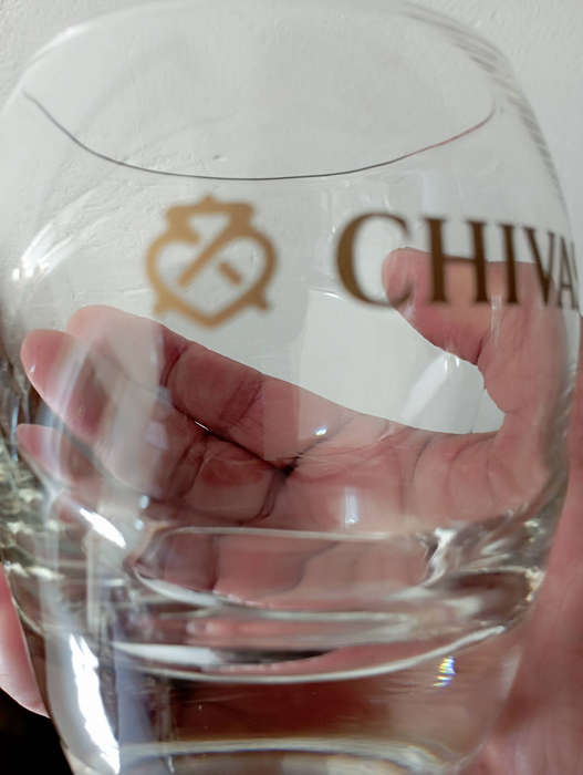A pair of Chivas gold logo whisky glasses with heavy bottoms in excellent condition as per scan