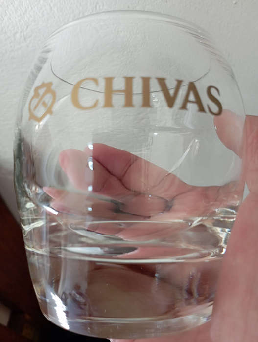 A pair of Chivas gold logo whisky glasses with heavy bottoms in excellent condition as per scan
