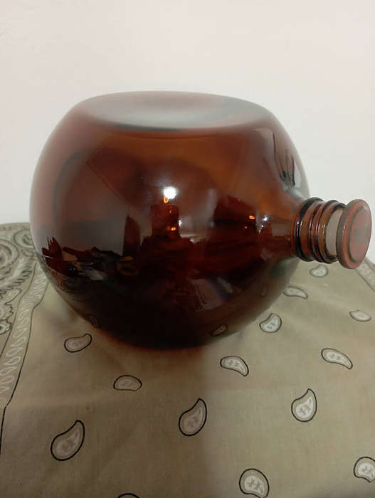 Old amber glass Saki bottle Japan