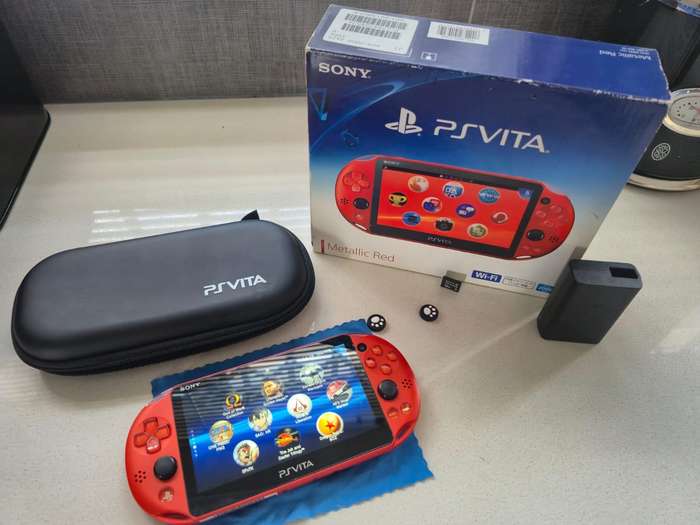 PS Vita 2000 Metallic Red, 128GB Evo SD Card, Pouch, 16GB Vita Card