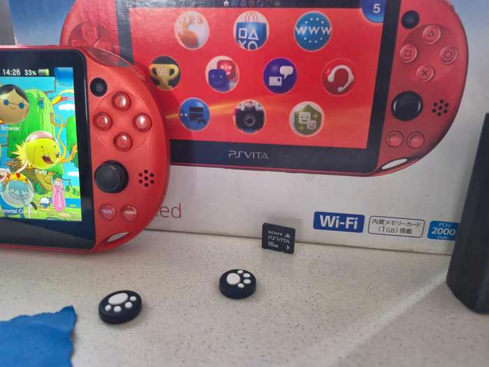 PS Vita 2000 Metallic Red, 128GB Evo SD Card, Pouch, 16GB Vita Card