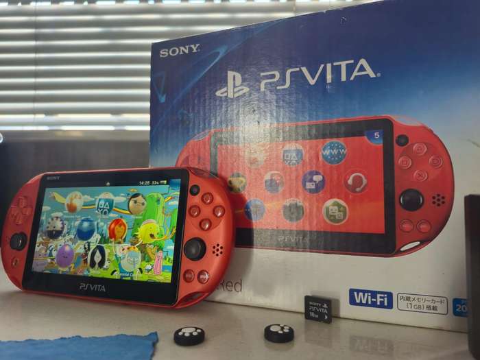 PS Vita 2000 Metallic Red, 128GB Evo SD Card, Pouch, 16GB Vita Card