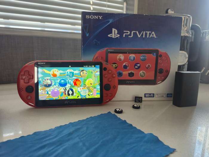 PS Vita 2000 Metallic Red, 128GB Evo SD Card, Pouch, 16GB Vita Card