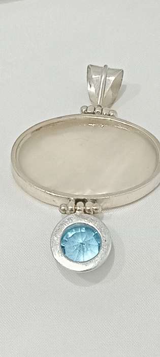 Vintage sterling silver pendant with MOP and blue stone
