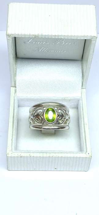 Sterling silver broad ring with green stone